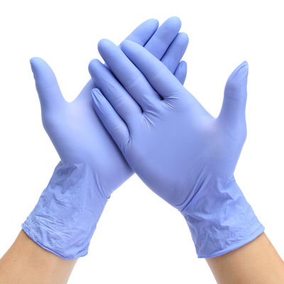 青い手の心配のグリップが付いている使い捨て可能で青いニトリルの手袋Xl